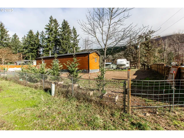 a backyard of a house with lots of green space