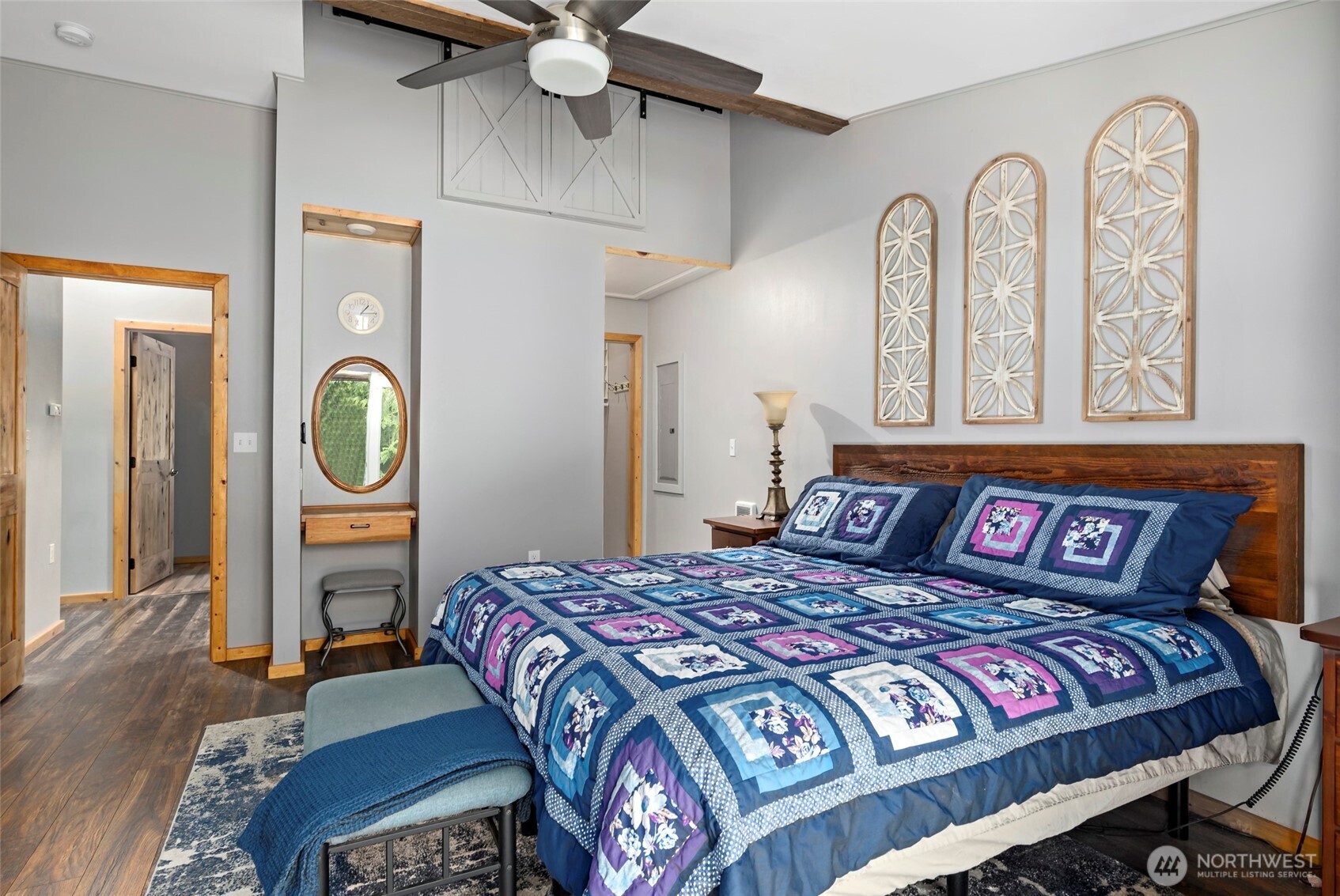 25451 Lake Cavanaugh Road Mount Vernon, WA 98274 - Photo 18 of 40 a bedroom with a bed a dresser and window