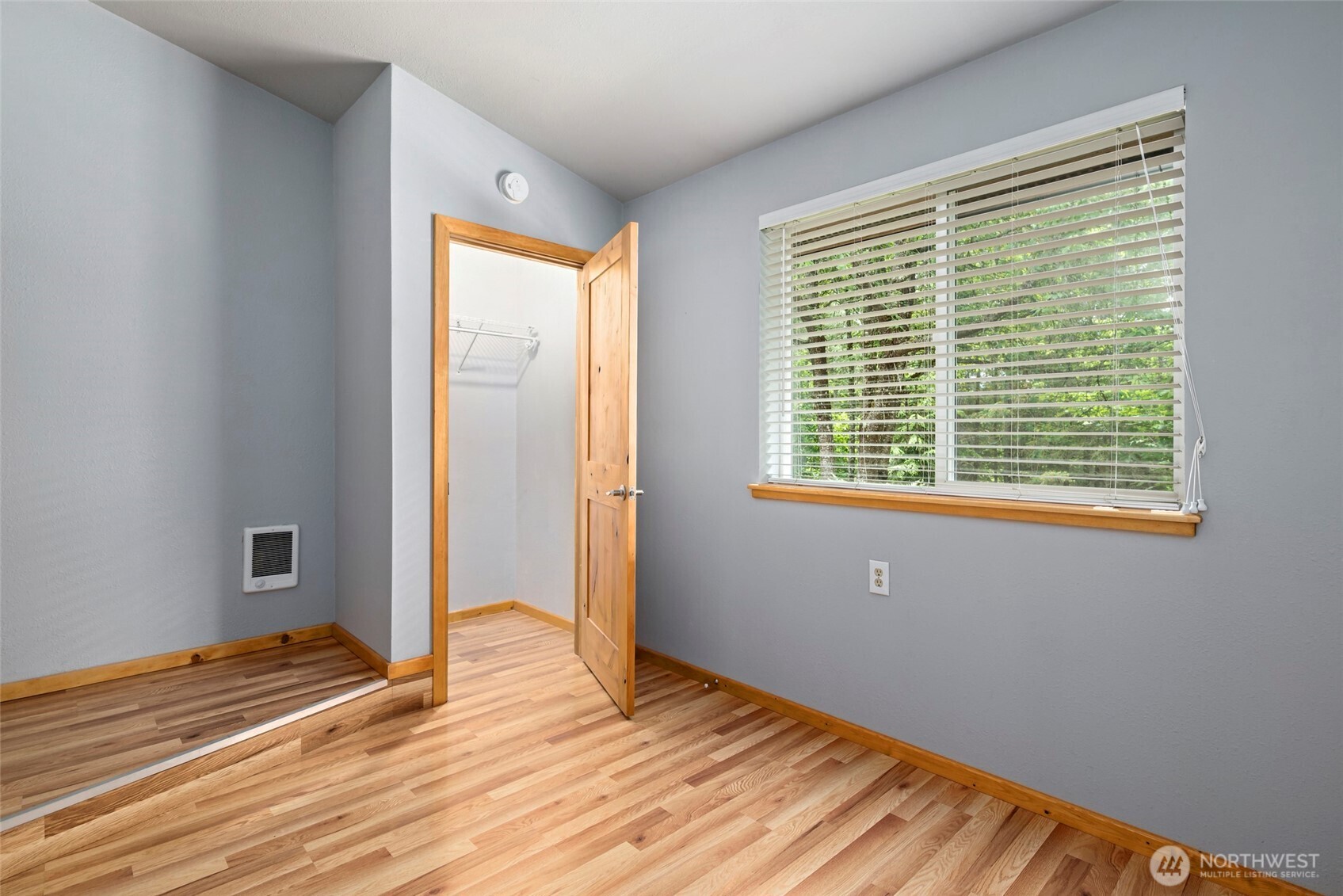 25451 Lake Cavanaugh Road Mount Vernon, WA 98274 - Photo 19 of 40 a view of an empty room with wooden floor and a window