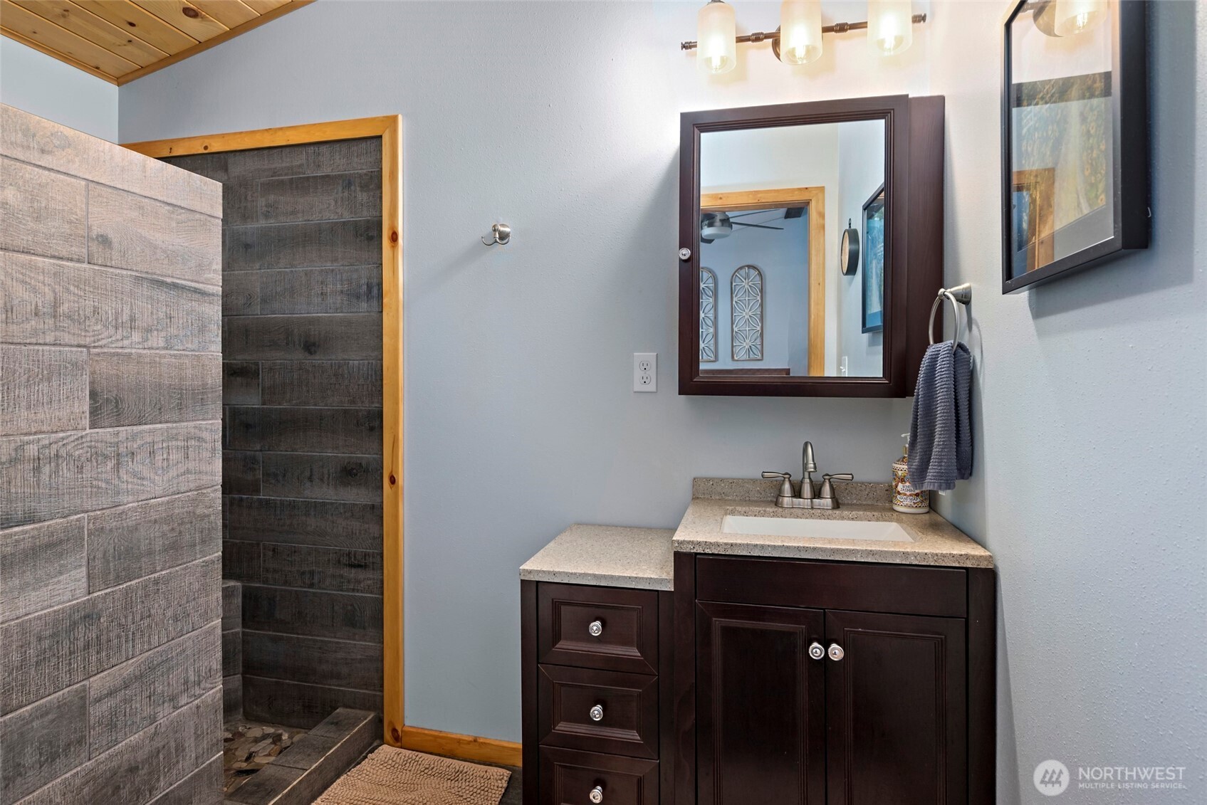25451 Lake Cavanaugh Road Mount Vernon, WA 98274 - Photo 21 of 40 a bathroom with a sink and a mirror