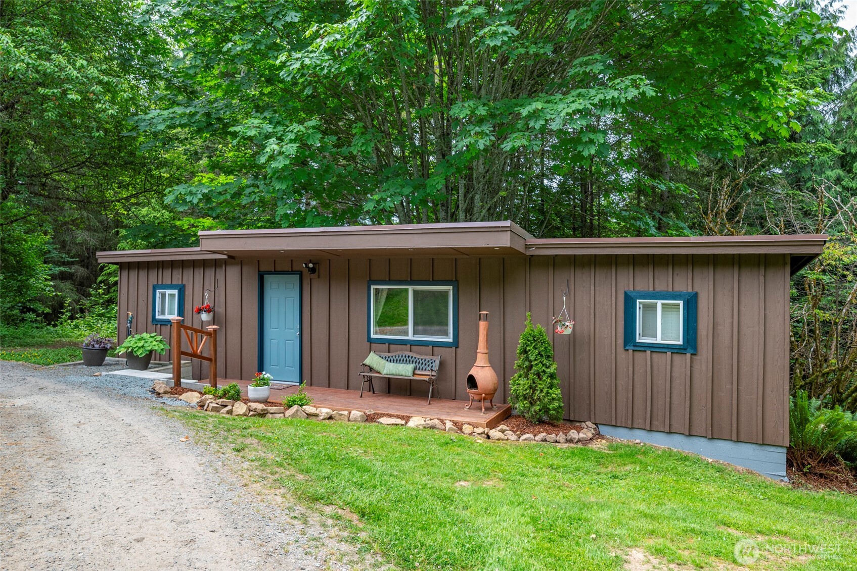 25451 Lake Cavanaugh Road Mount Vernon, WA 98274 - Photo 25 of 40 a view of a house with a yard and plants