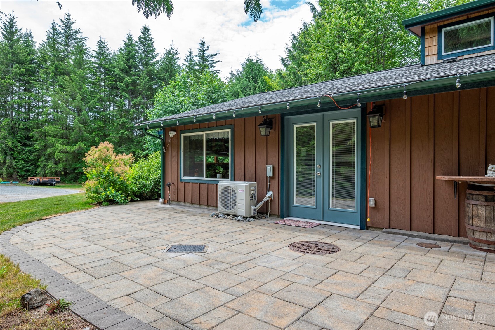 25451 Lake Cavanaugh Road Mount Vernon, WA 98274 - Photo 5 of 40 a view of backyard with seating space and wooden fence