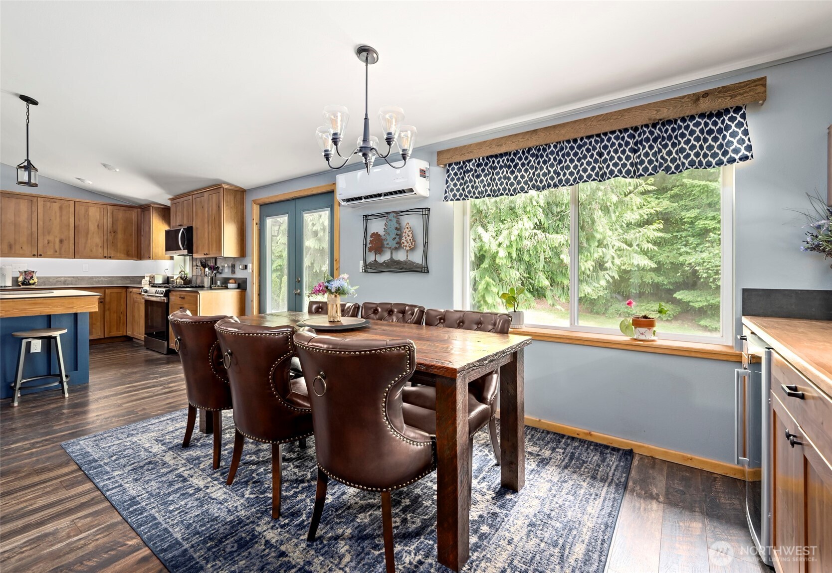 25451 Lake Cavanaugh Road Mount Vernon, WA 98274 - Photo 8 of 40 a view of a dining room with furniture window and wooden floor