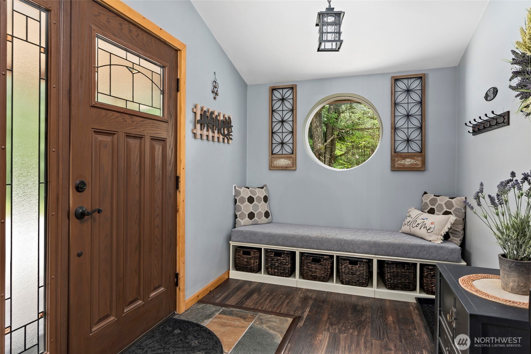 25451 Lake Cavanaugh Road Mount Vernon, WA 98274 - Photo 9 of 40 a front view of a house with lots of wooden furniture