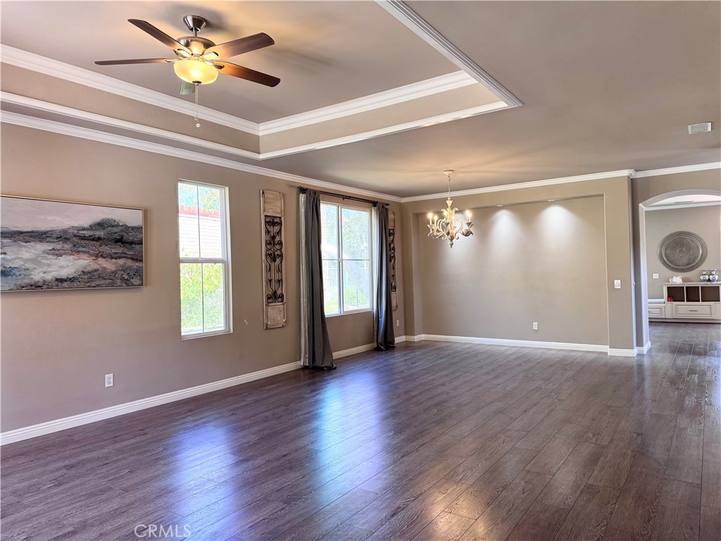 28463 Cascade Road Castaic, CA 91384 - Photo 3 of 29 a view of an empty room with window and wooden floor