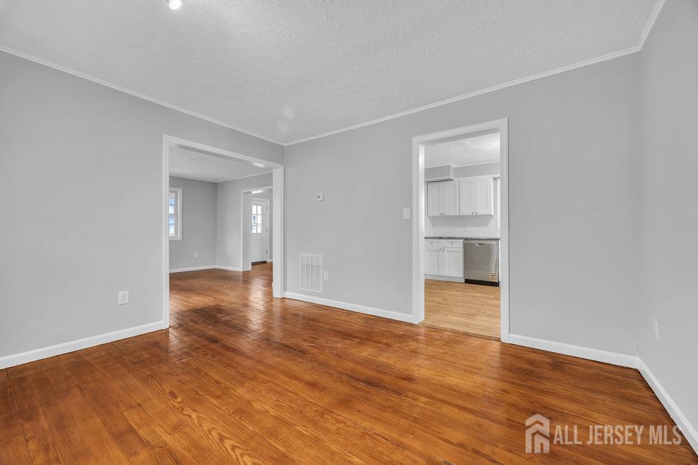 49 Comstock Street New Brunswick, NJ 08901 - Photo 13 of 20 a view of empty room with wooden floor
