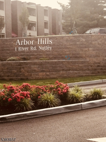 822 Main Street, Unit E Nutley, NJ 07110 - Photo 13 of 14 a view of a street with a wooden fence