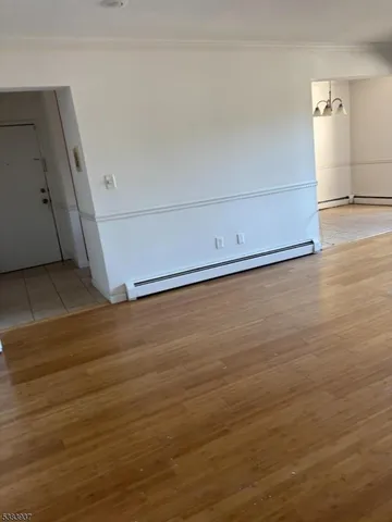 an empty room with wooden floor