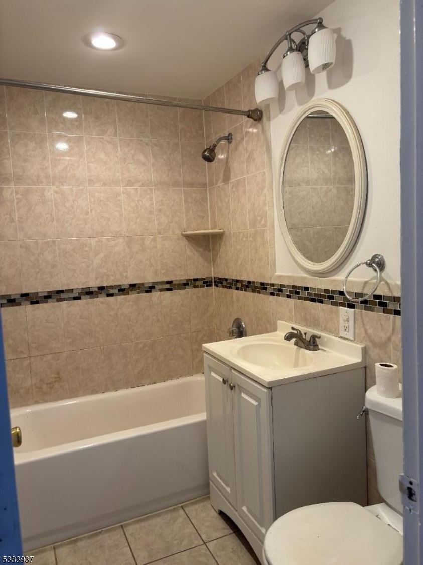 822 Main Street, Unit E Nutley, NJ 07110 - Photo 10 of 14 a bathroom with a sink toilet and shower