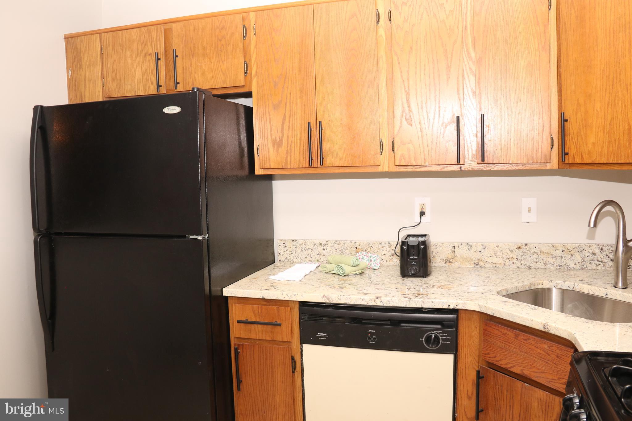606 Woodchip Road Lumberton, NJ 08048 - Photo 8 of 18 a kitchen with a refrigerator and a sink