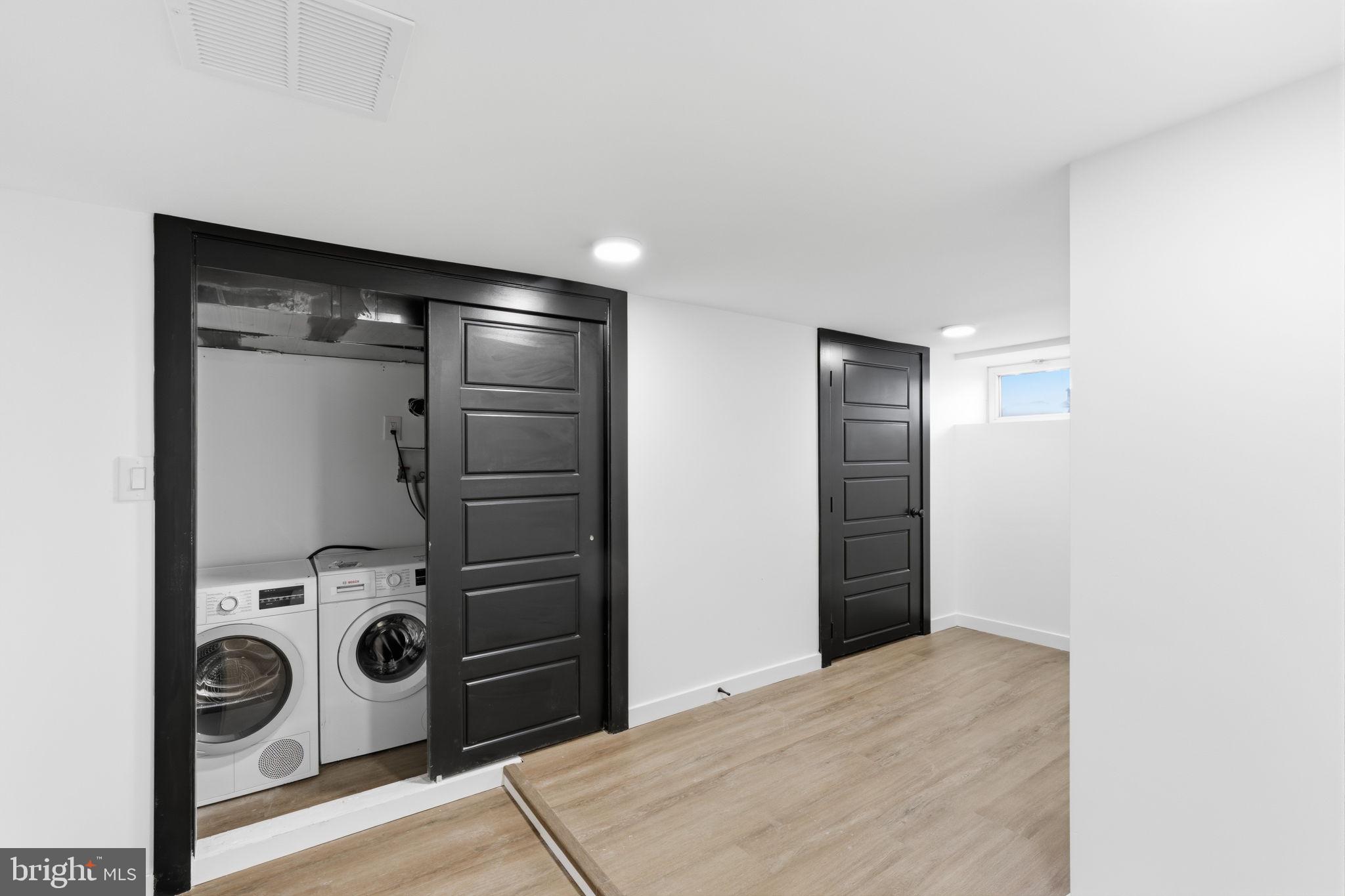 6508 Wheeler Street Philadelphia, PA 19142 - Photo 12 of 30 a view of a storage & utility room with washer and dryer