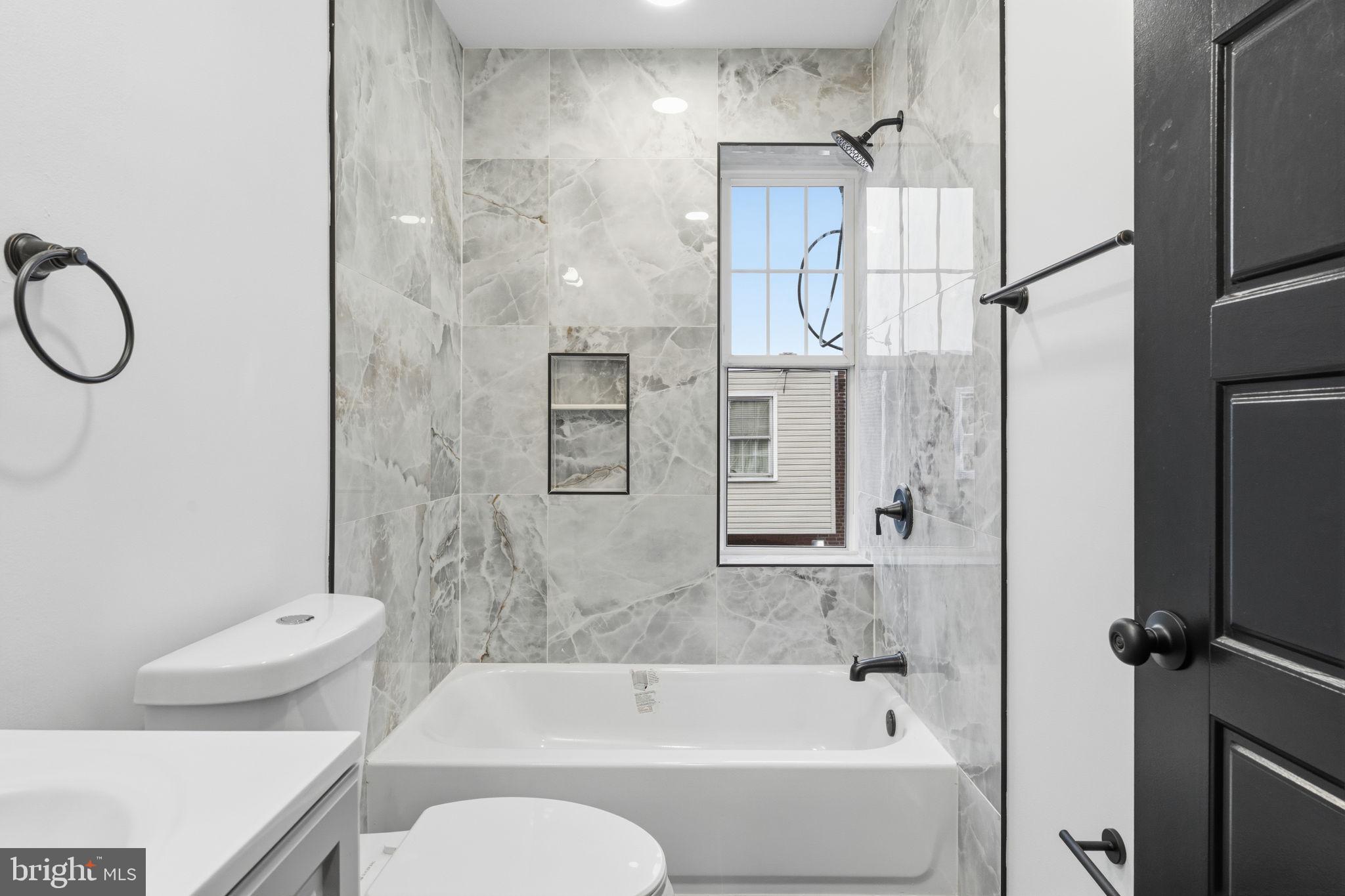 6508 Wheeler Street Philadelphia, PA 19142 - Photo 26 of 30 a bathroom with a toilet sink and shower