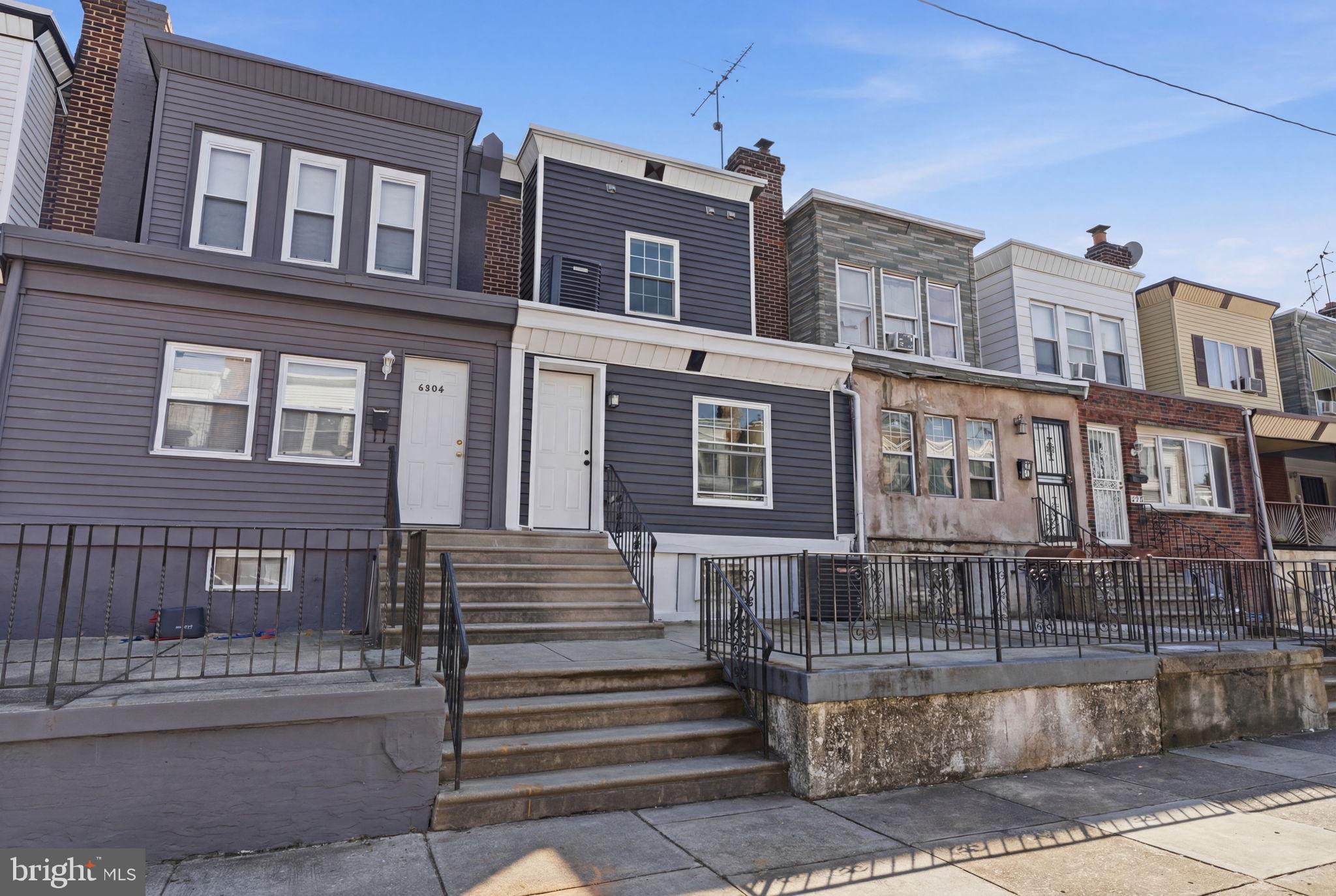 6508 Wheeler Street Philadelphia, PA 19142 - Photo 3 of 30 a front view of a house with a yard