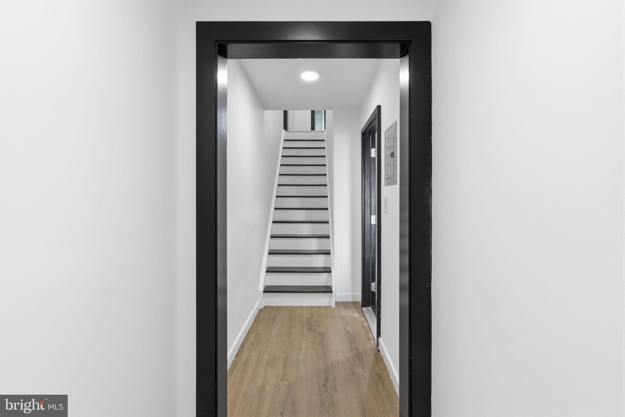 6508 Wheeler Street Philadelphia, PA 19142 - Photo 4 of 30 a view of a hallway with stairs