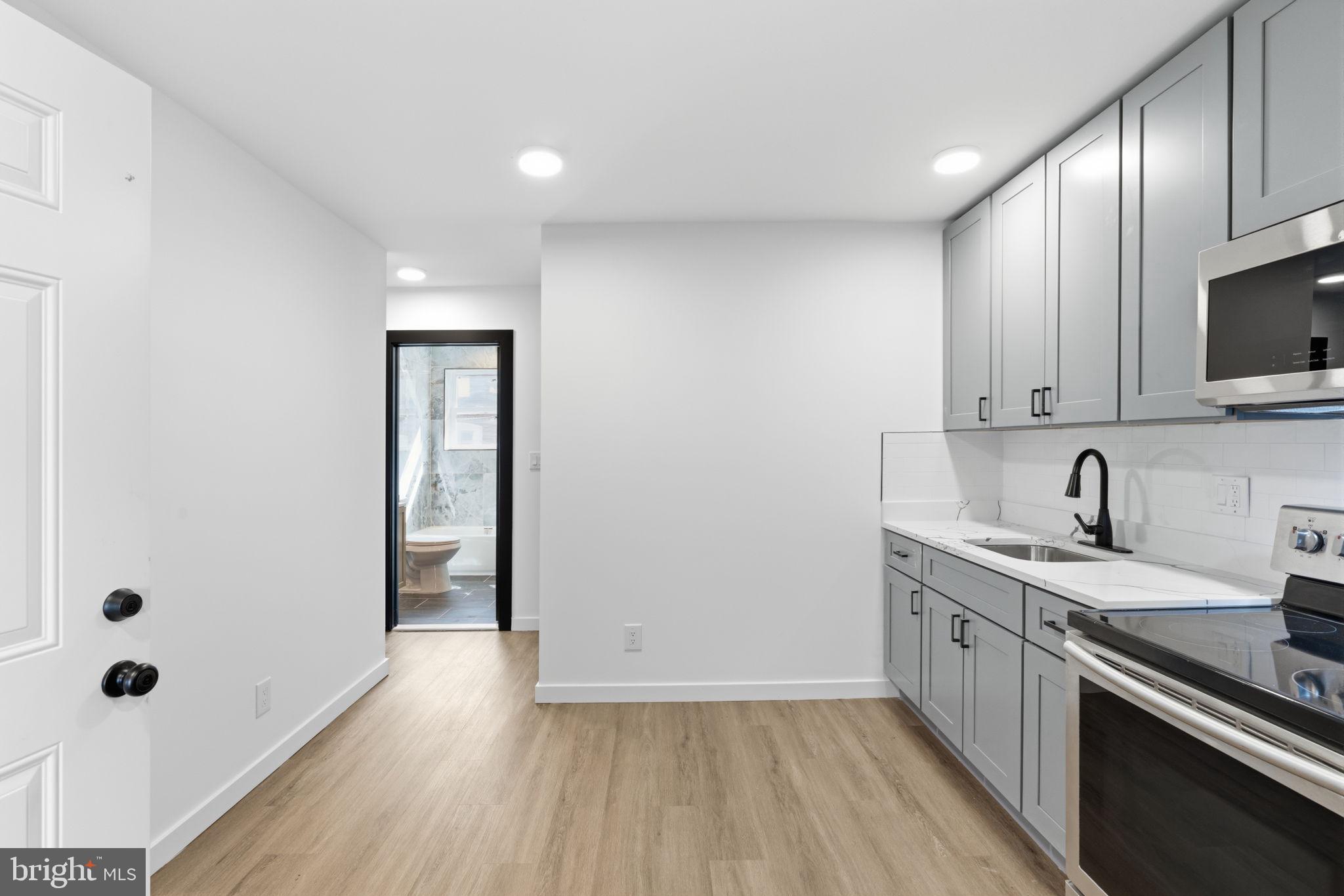 6508 Wheeler Street Philadelphia, PA 19142 - Photo 8 of 30 a view of a kitchen with electric appliances