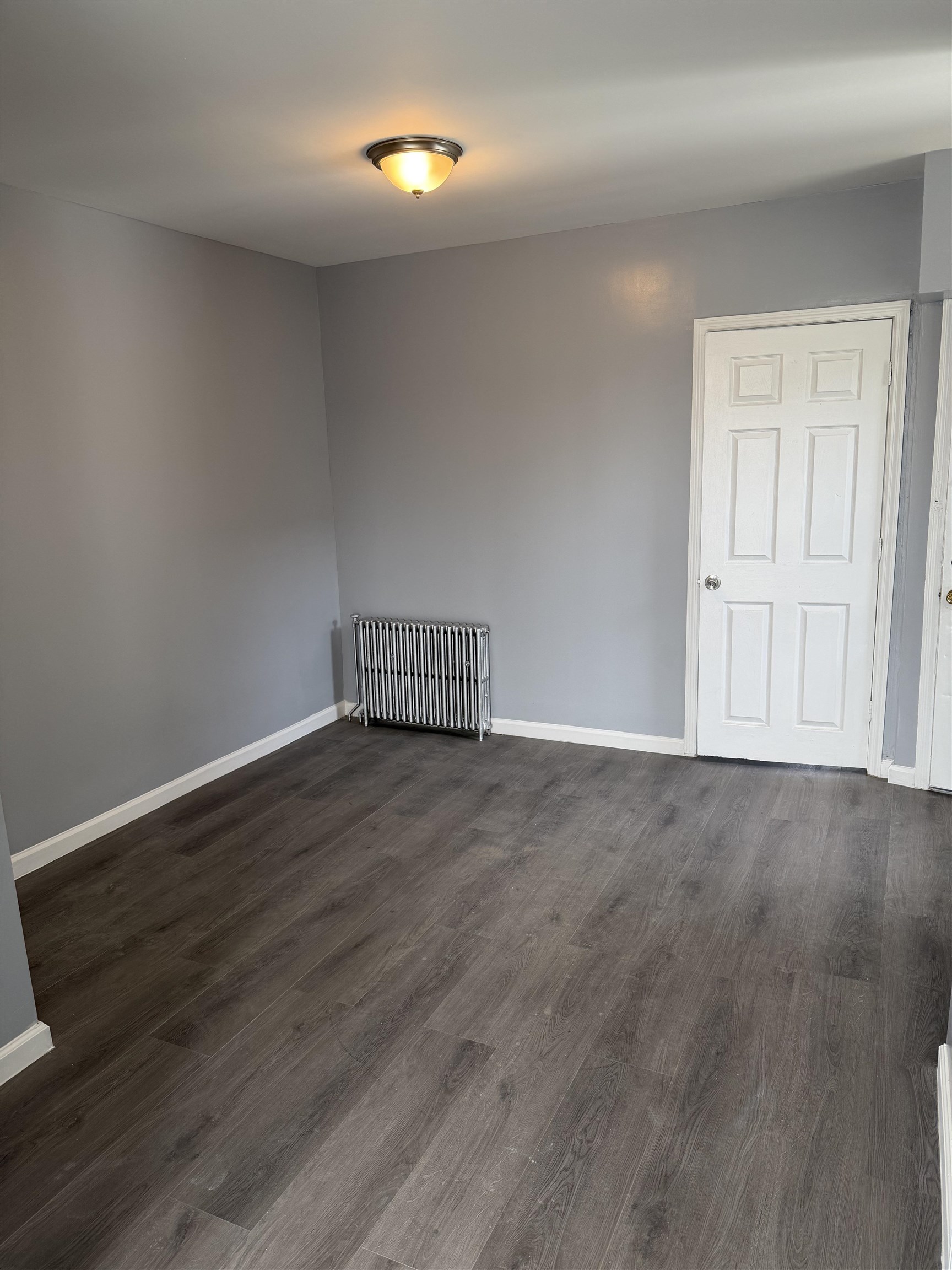 419 4th Street, Unit 1 Union City, NJ 07087 - Photo 11 of 20 a view of empty room with wooden floor