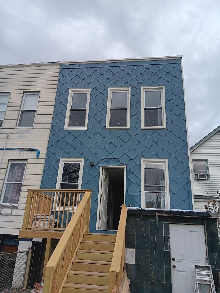 419 4th Street, Unit 1 Union City, NJ 07087 - Photo 20 of 20 a view of a brick house with wooden deck