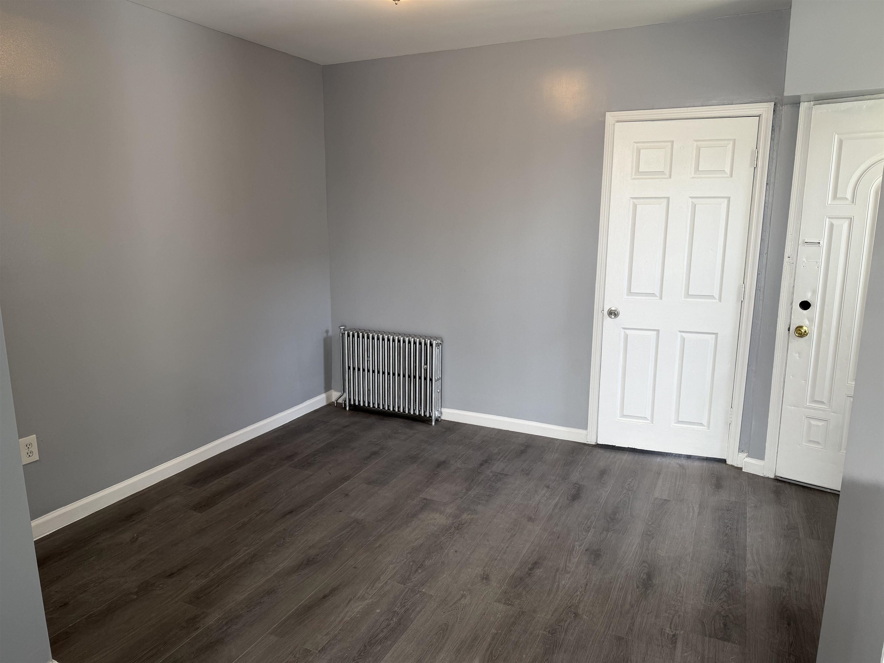 419 4th Street, Unit 1 Union City, NJ 07087 - Photo 6 of 20 an empty room with wooden floor & closet