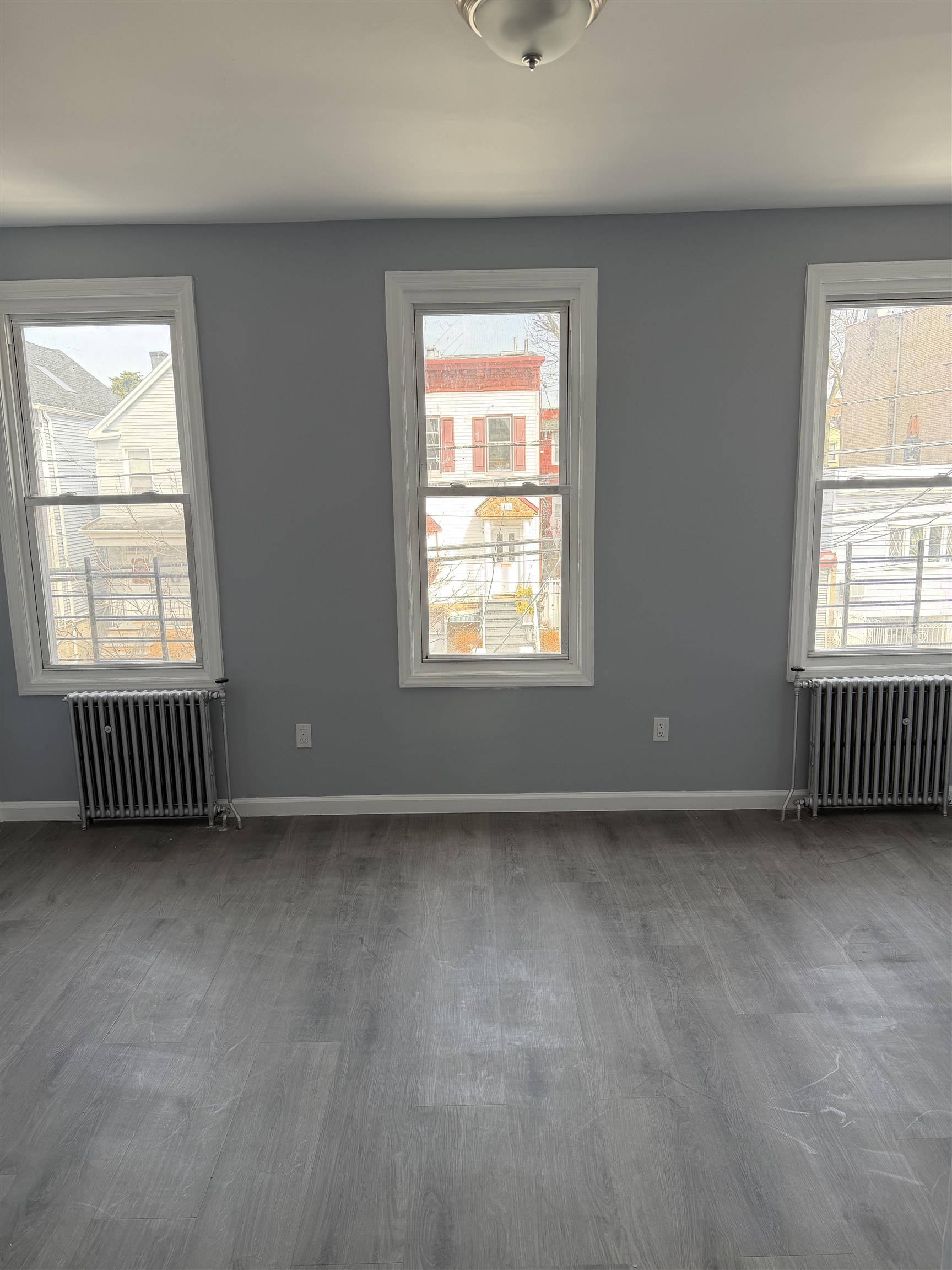 419 4th Street, Unit 1 Union City, NJ 07087 - Photo 7 of 20 an empty room with a window