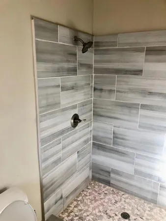 a view of a room with wooden floor