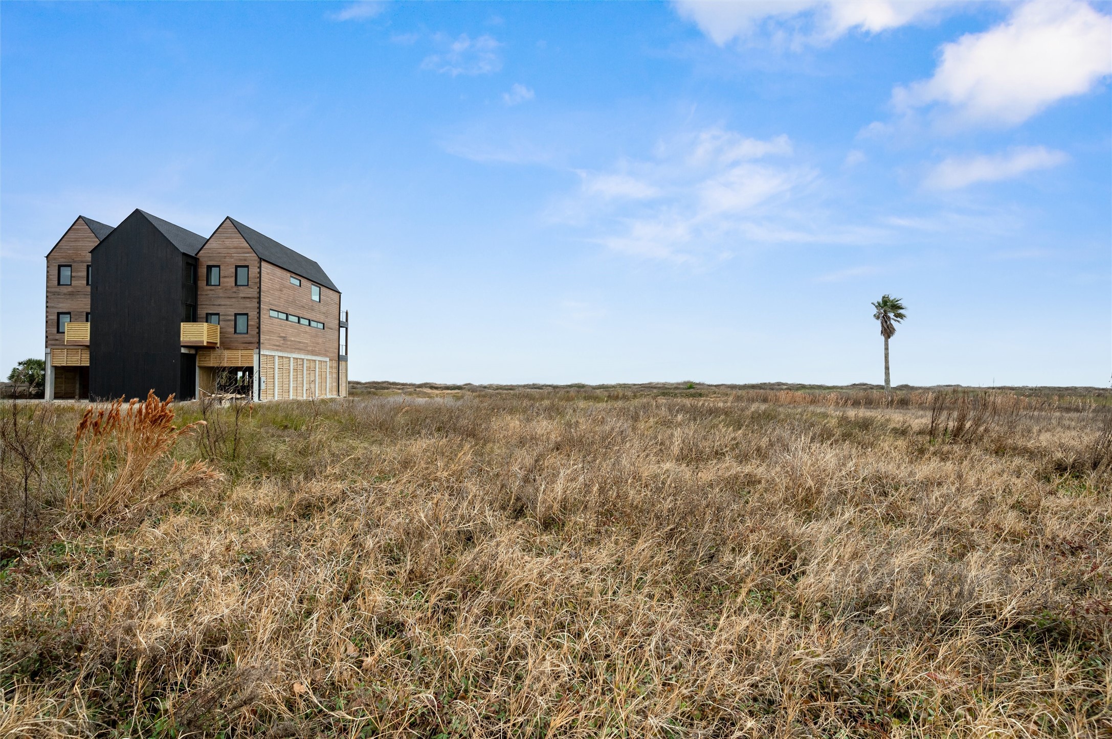 338 Atkinson Street Crystal Beach, TX 77650 - Photo 13 of 13 a view of a city with tall buildings