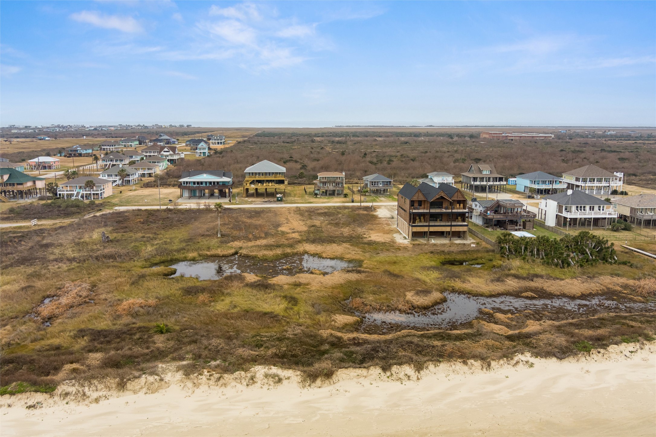 338 Atkinson Street Crystal Beach, TX 77650 - Photo 9 of 13 an aerial view of residential houses with outdoor space