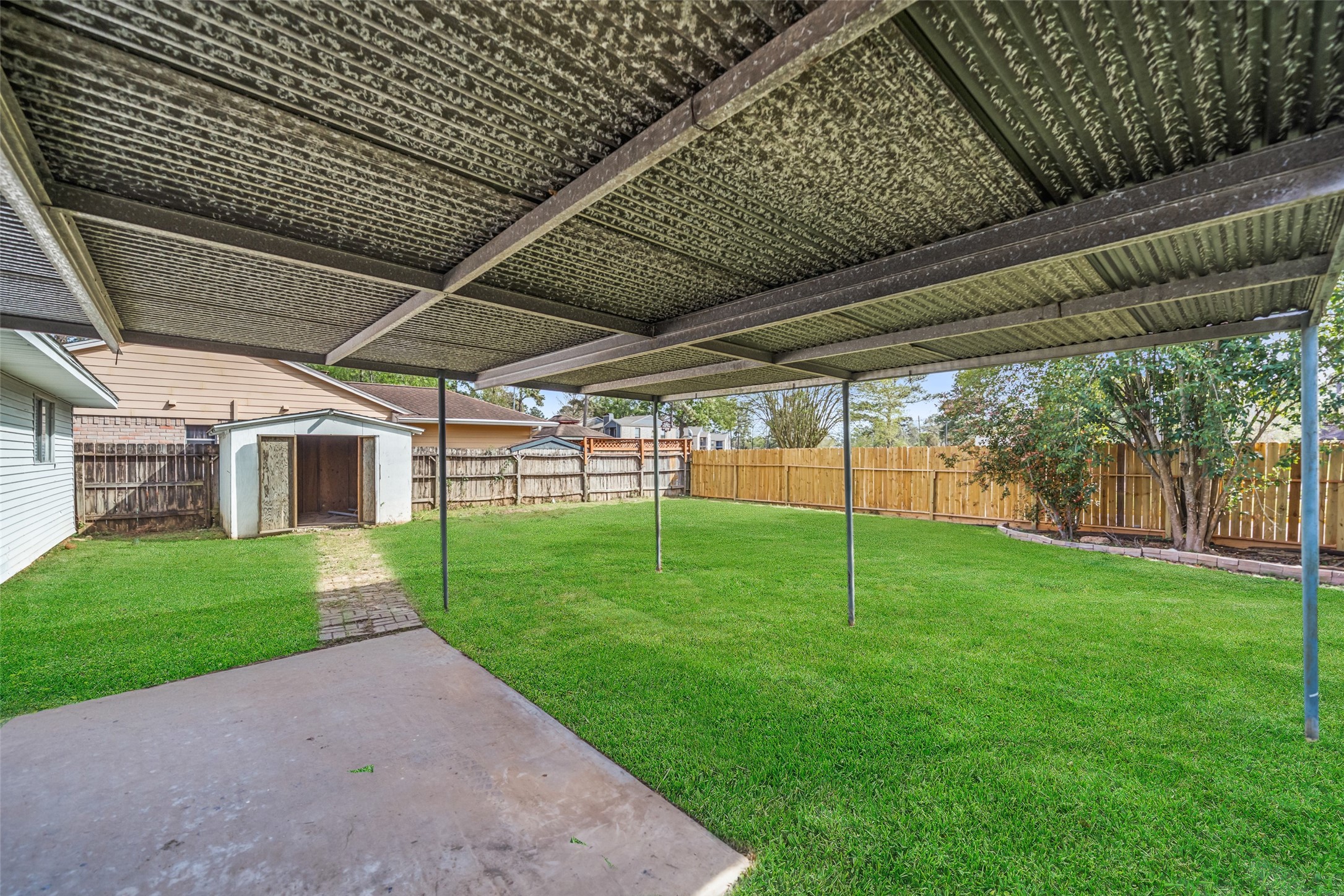 5726 Yorkgate Drive Spring, TX 77373 - Photo 20 of 20 a view of a backyard with plants and garden