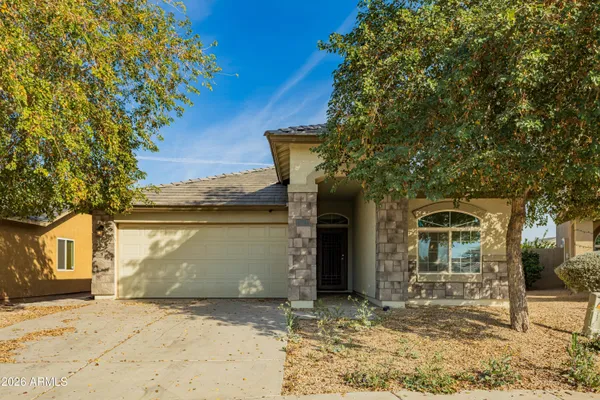 a view of a house with a tree