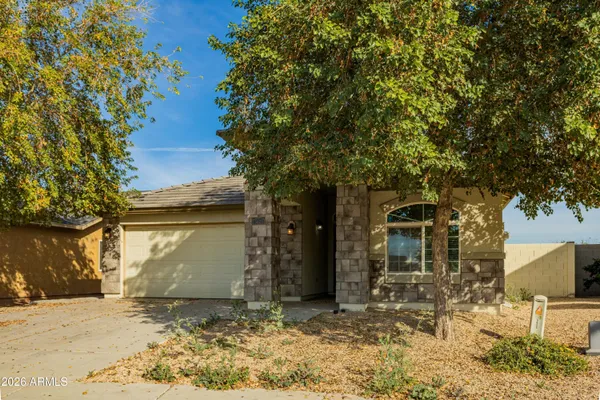 a view of a house with a tree