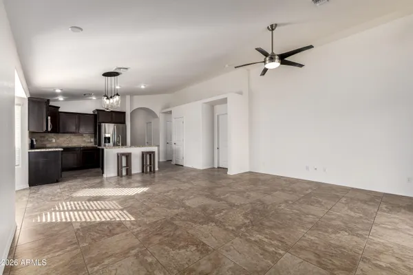 a view of a kitchen with a sink stainless steel appliances and cabinets