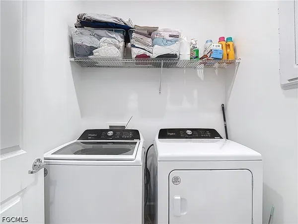 a utility room with dryer and washer