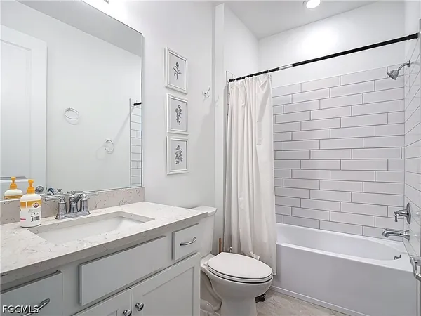 a bathroom with a sink a toilet and a bathtub