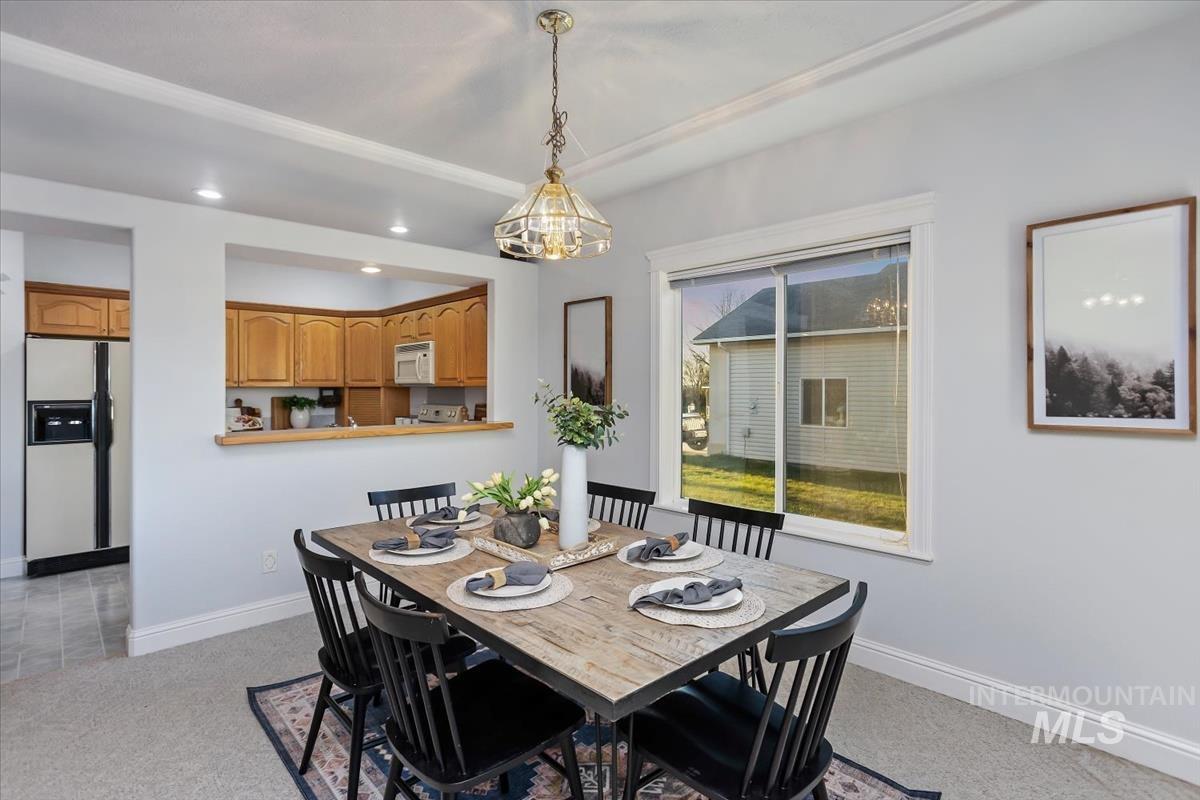 25074 The Driving Lane Caldwell, ID 83607 - Photo 7 of 32 Dining area featuring recessed lighting and baseboards