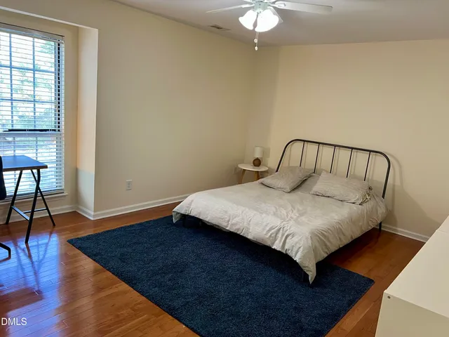 a kitchen with a refrigerator and a stove top oven