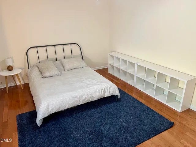 a view of a livingroom with furniture and staircase