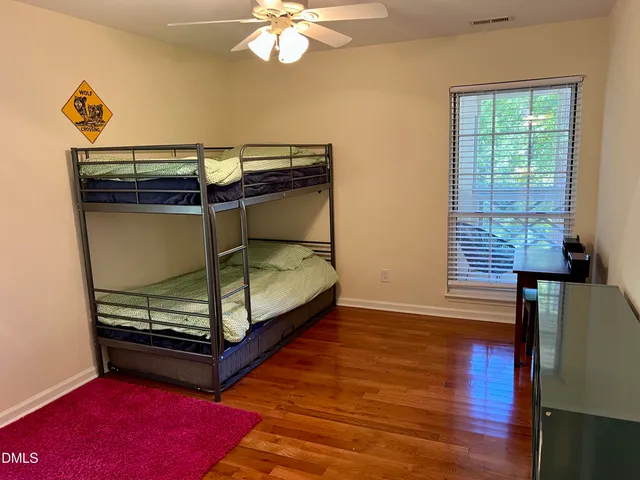 a bathroom with a sink toilet and a mirror