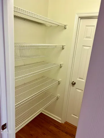 a white toilet sitting next to a shower curtain