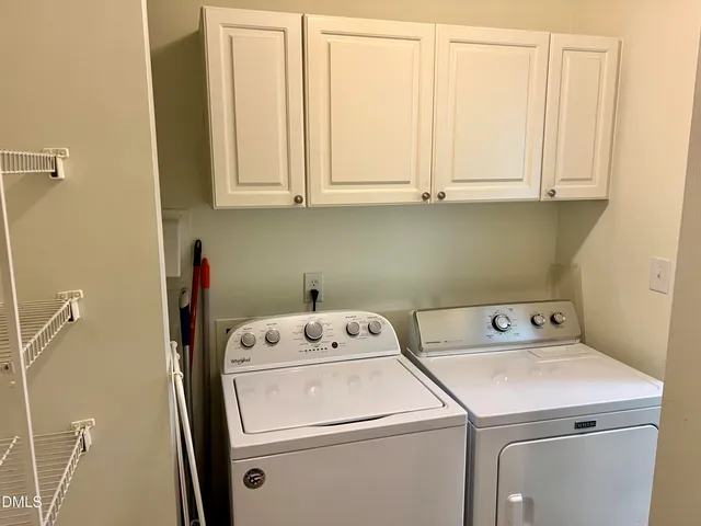 a view of a two chairs in the balcony