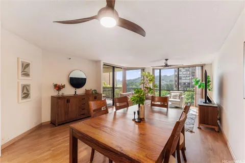 a view of a dining room with furniture window and wooden floor