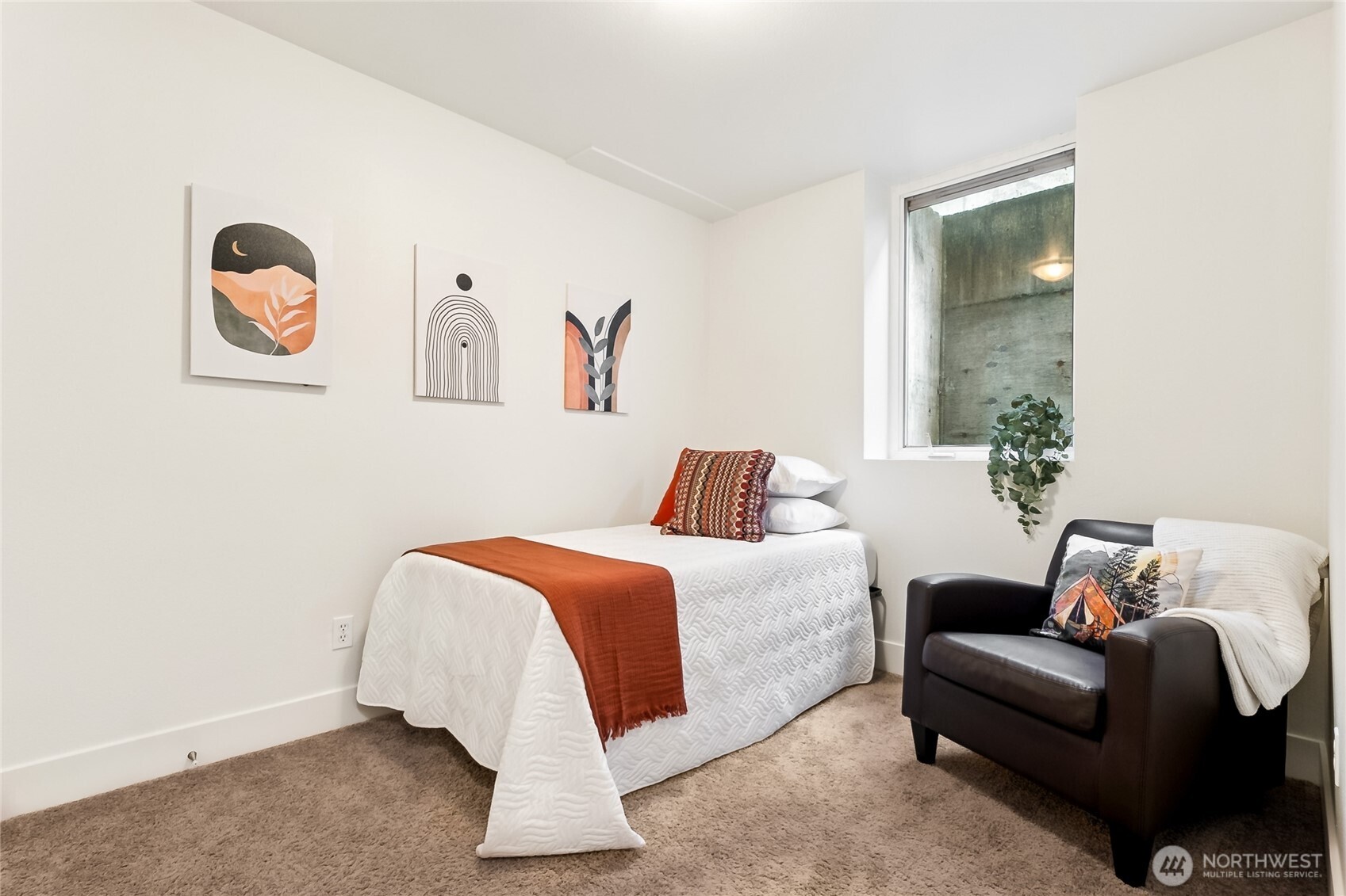 5907 40th Avenue Southwest, Unit B Seattle, WA 98136 - Photo 11 of 23 a bed room with a bed and a couch