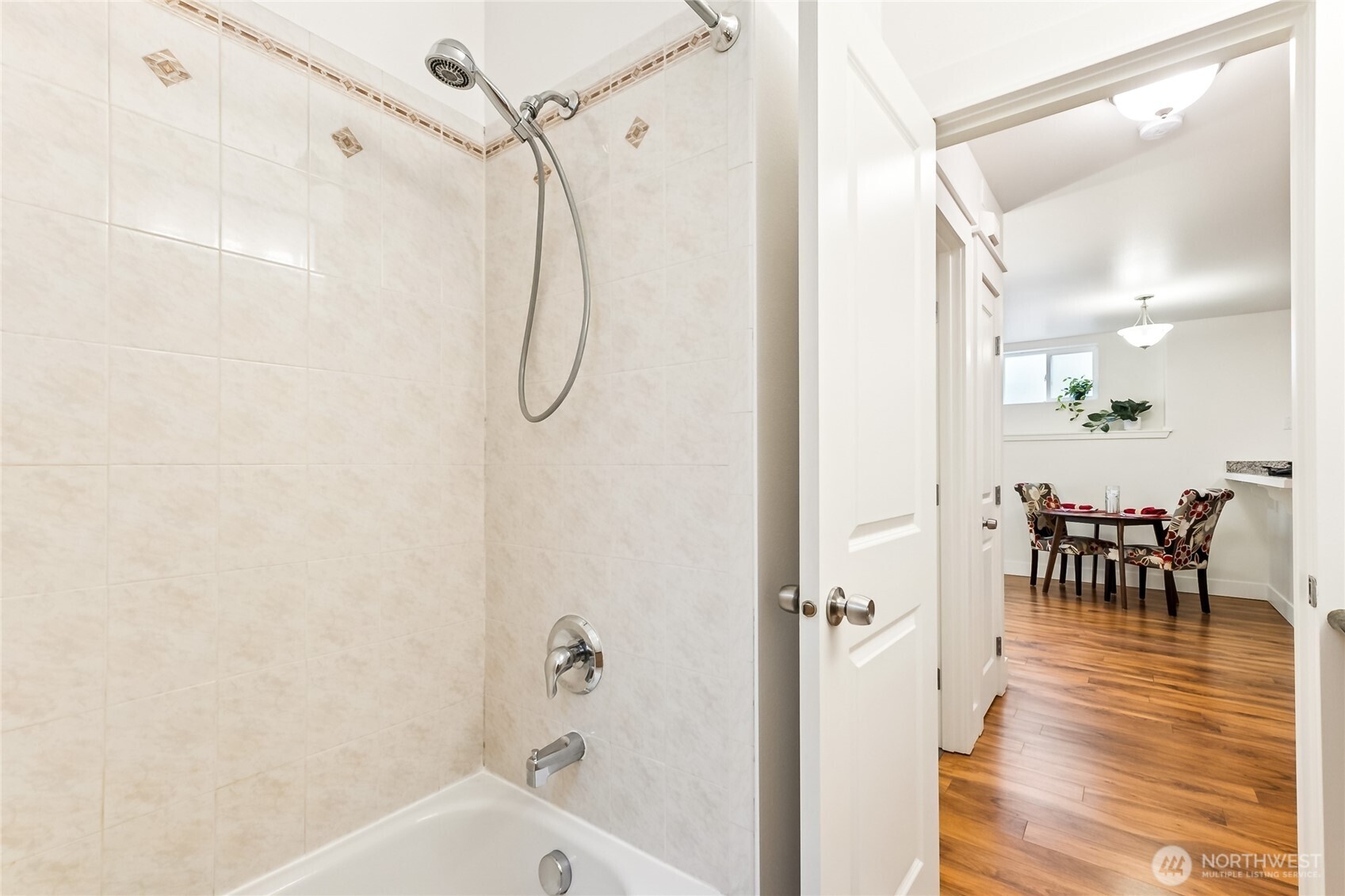 5907 40th Avenue Southwest, Unit B Seattle, WA 98136 - Photo 13 of 23 a bathroom with a bathtub and a shower