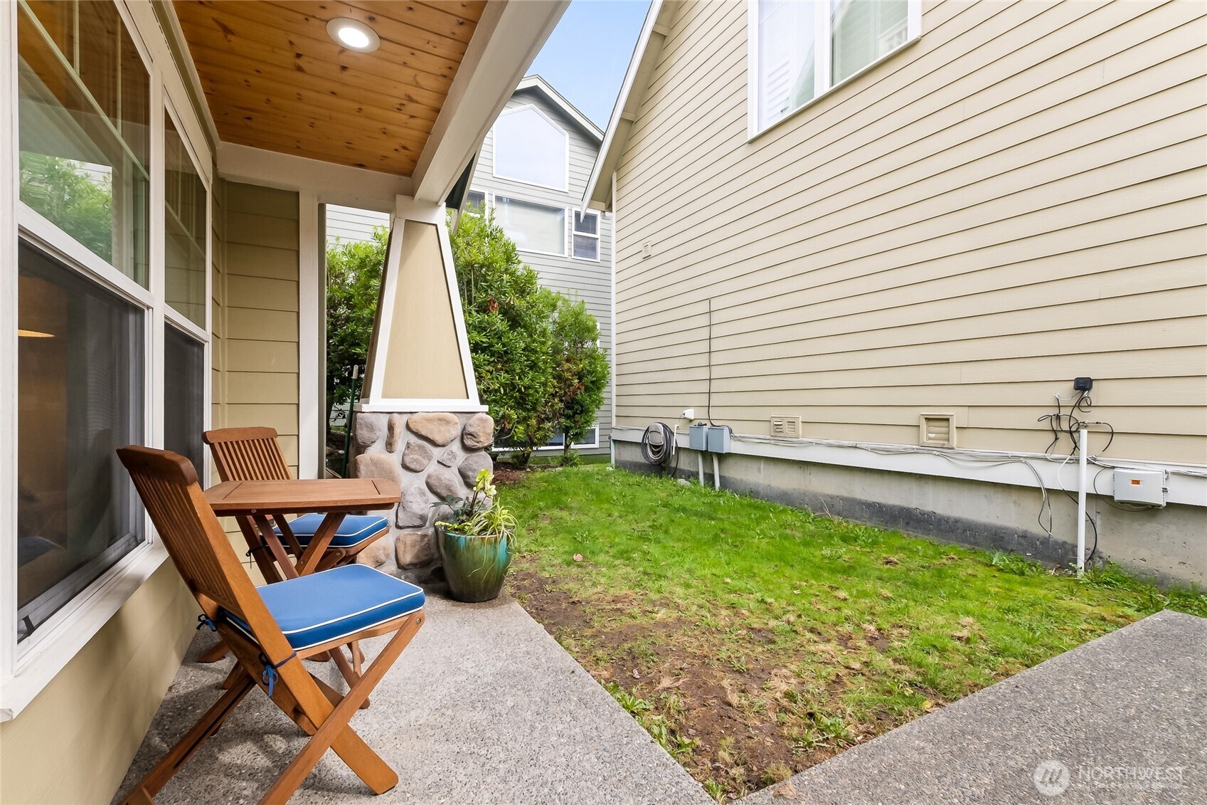 5907 40th Avenue Southwest, Unit B Seattle, WA 98136 - Photo 14 of 23 a view of a chair and table in backyard of the house