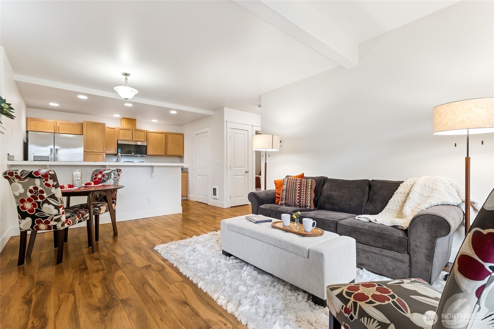5907 40th Avenue Southwest, Unit B Seattle, WA 98136 - Photo 2 of 23 a living room with furniture and a table