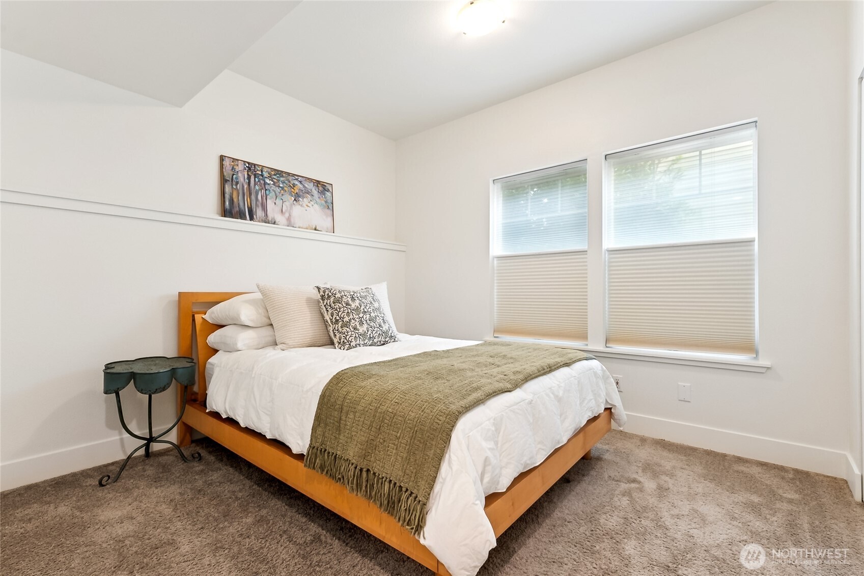 5907 40th Avenue Southwest, Unit B Seattle, WA 98136 - Photo 10 of 23 a bed sitting in a bedroom next to a window