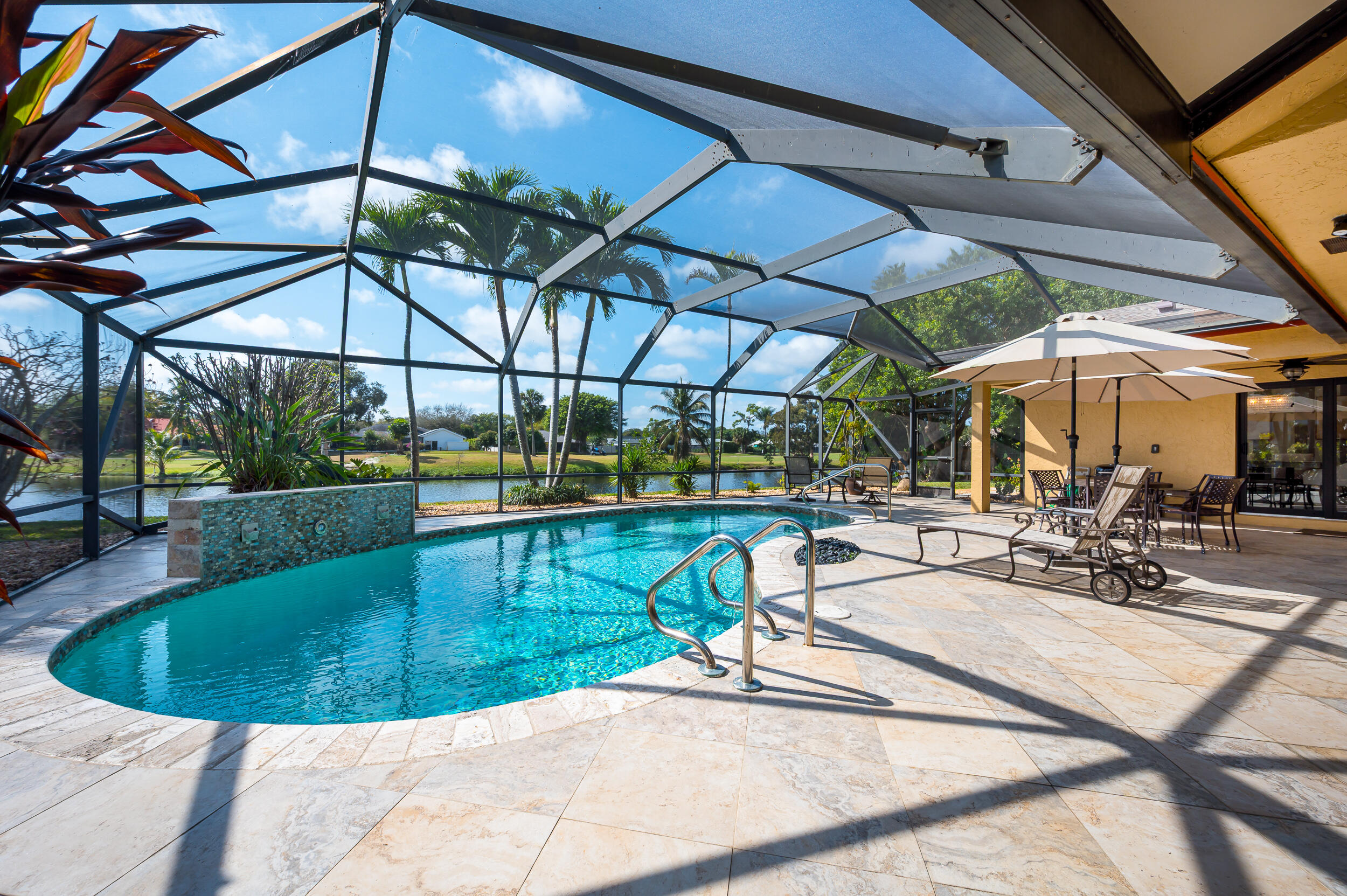 3250 Lakeview Boulevard Delray Beach, FL 33445 - Photo 1 of 26 a view of a swimming pool with a patio