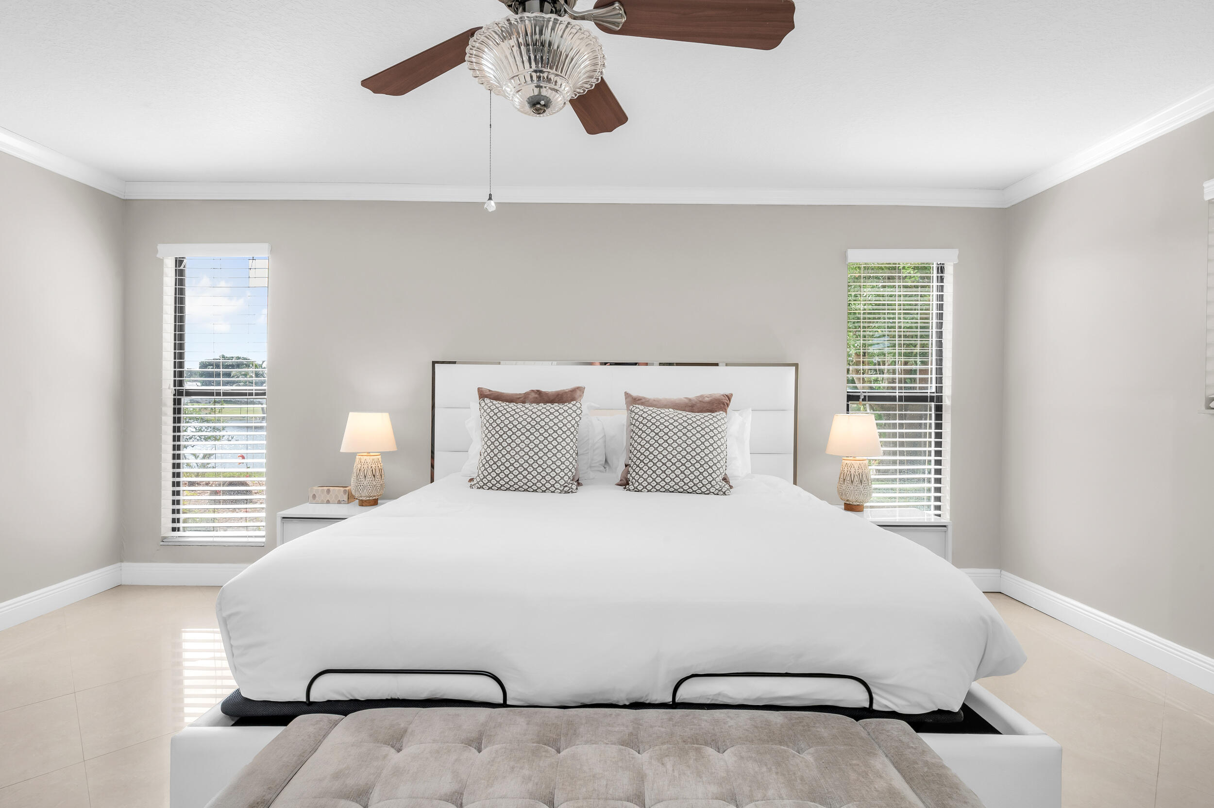 3250 Lakeview Boulevard Delray Beach, FL 33445 - Photo 13 of 26 a bedroom with a bed and window