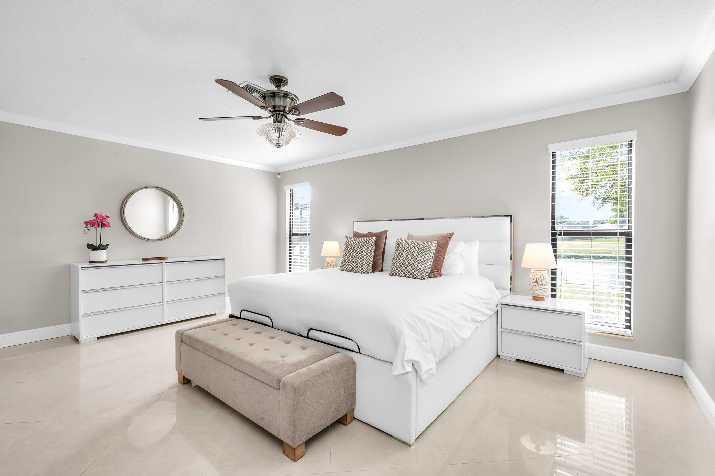 3250 Lakeview Boulevard Delray Beach, FL 33445 - Photo 14 of 26 a bedroom with a bed and window