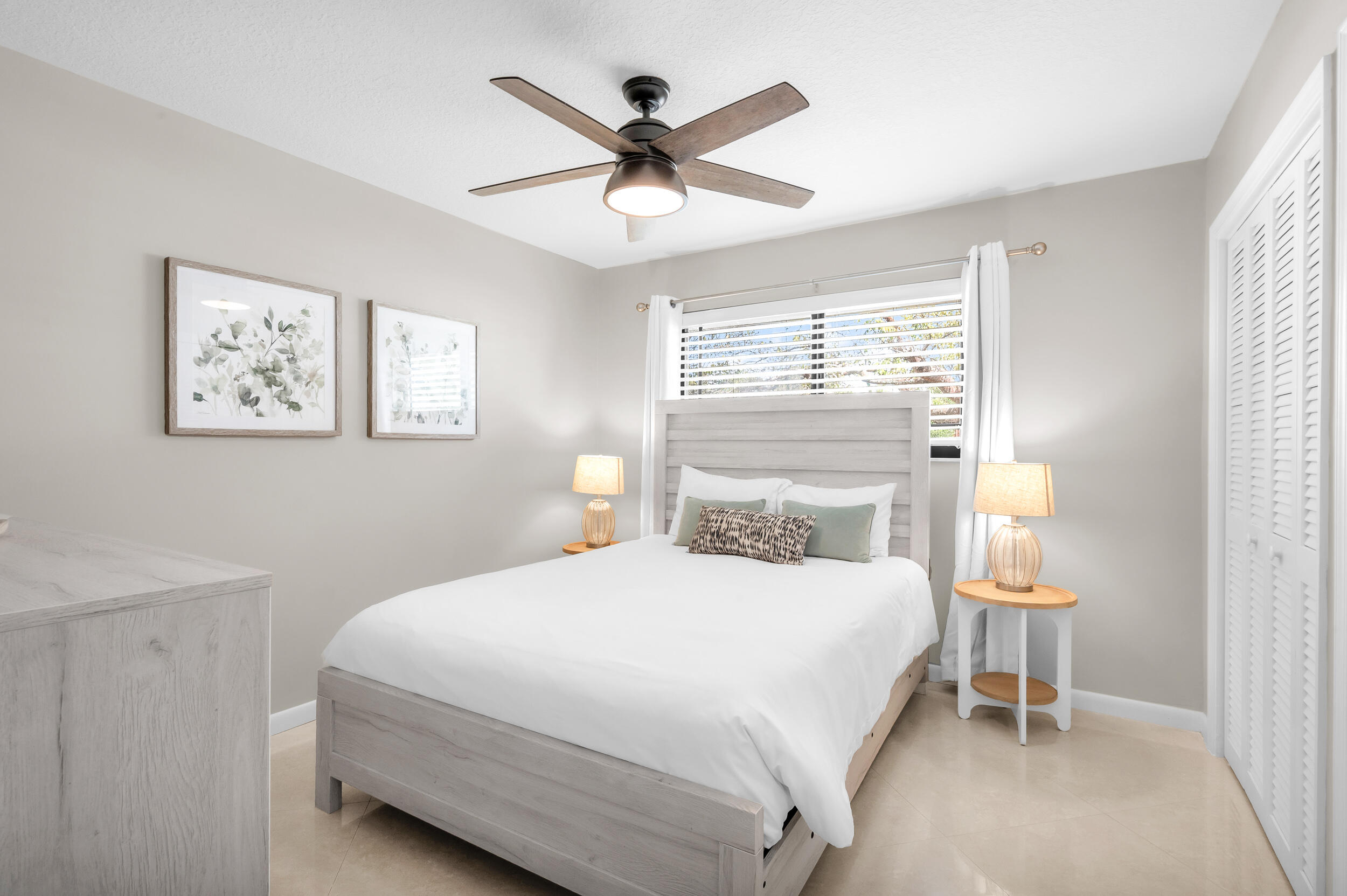 3250 Lakeview Boulevard Delray Beach, FL 33445 - Photo 17 of 26 a bedroom with a bed and a window