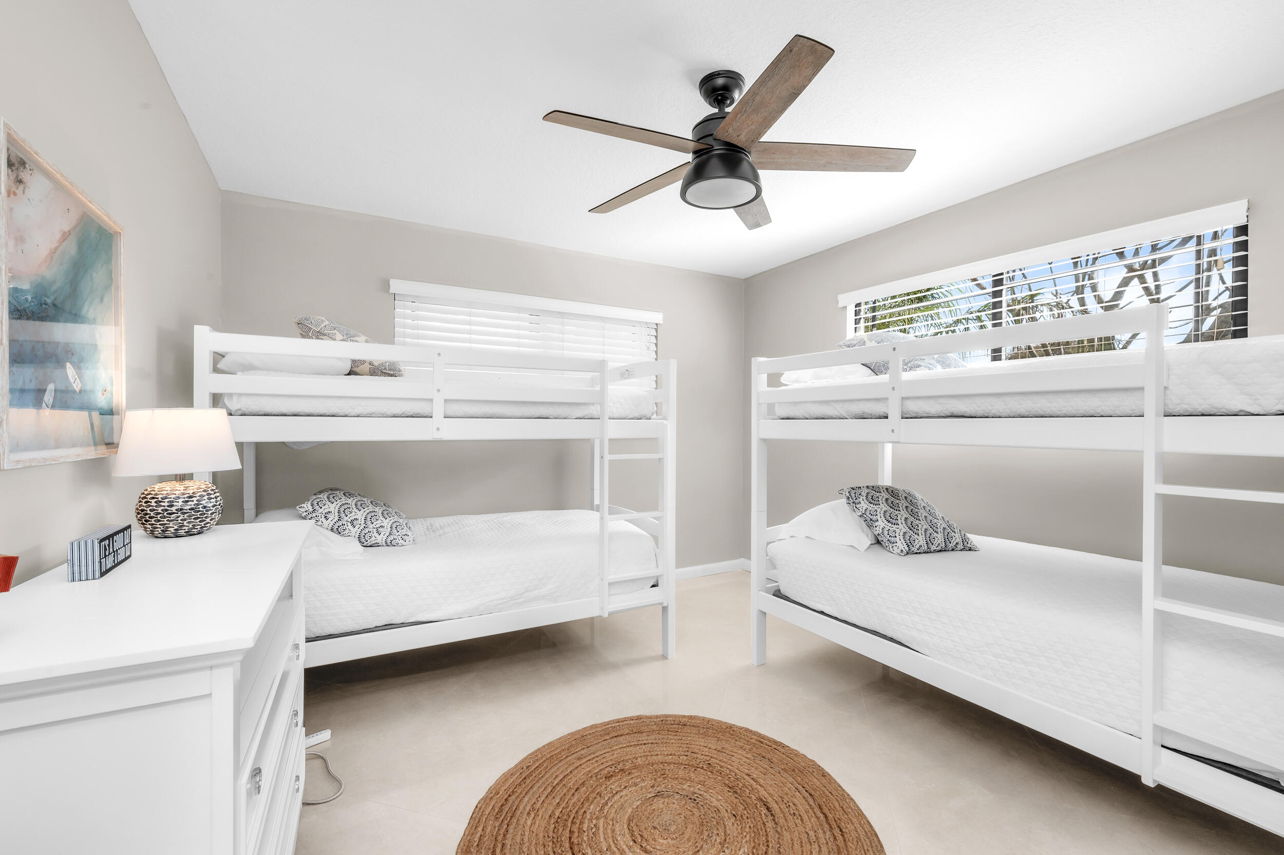 3250 Lakeview Boulevard Delray Beach, FL 33445 - Photo 19 of 26 a bedroom with a bed and a ceiling fan