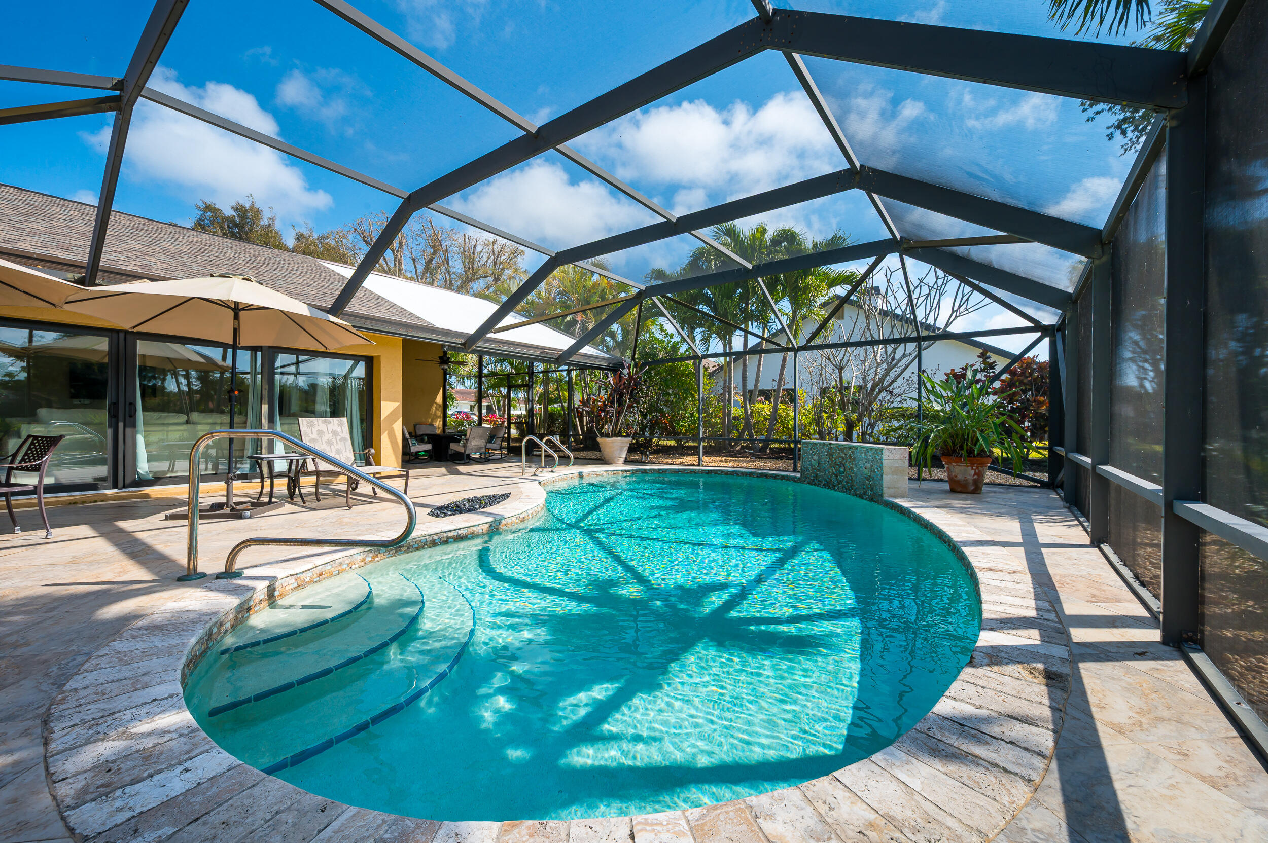 3250 Lakeview Boulevard Delray Beach, FL 33445 - Photo 21 of 26 a swimming pool with outdoor seating and yard